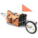 Rowerowa przyczepa na bagaż z pomarańczowo-czarną torbą