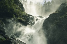 Fototapeta A Flowing Waterfall In Norway