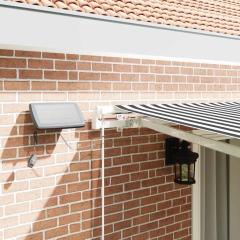 VidaXL Ręcznie zwijana markiza z LED, antracytowo-biała, 450x300 cm